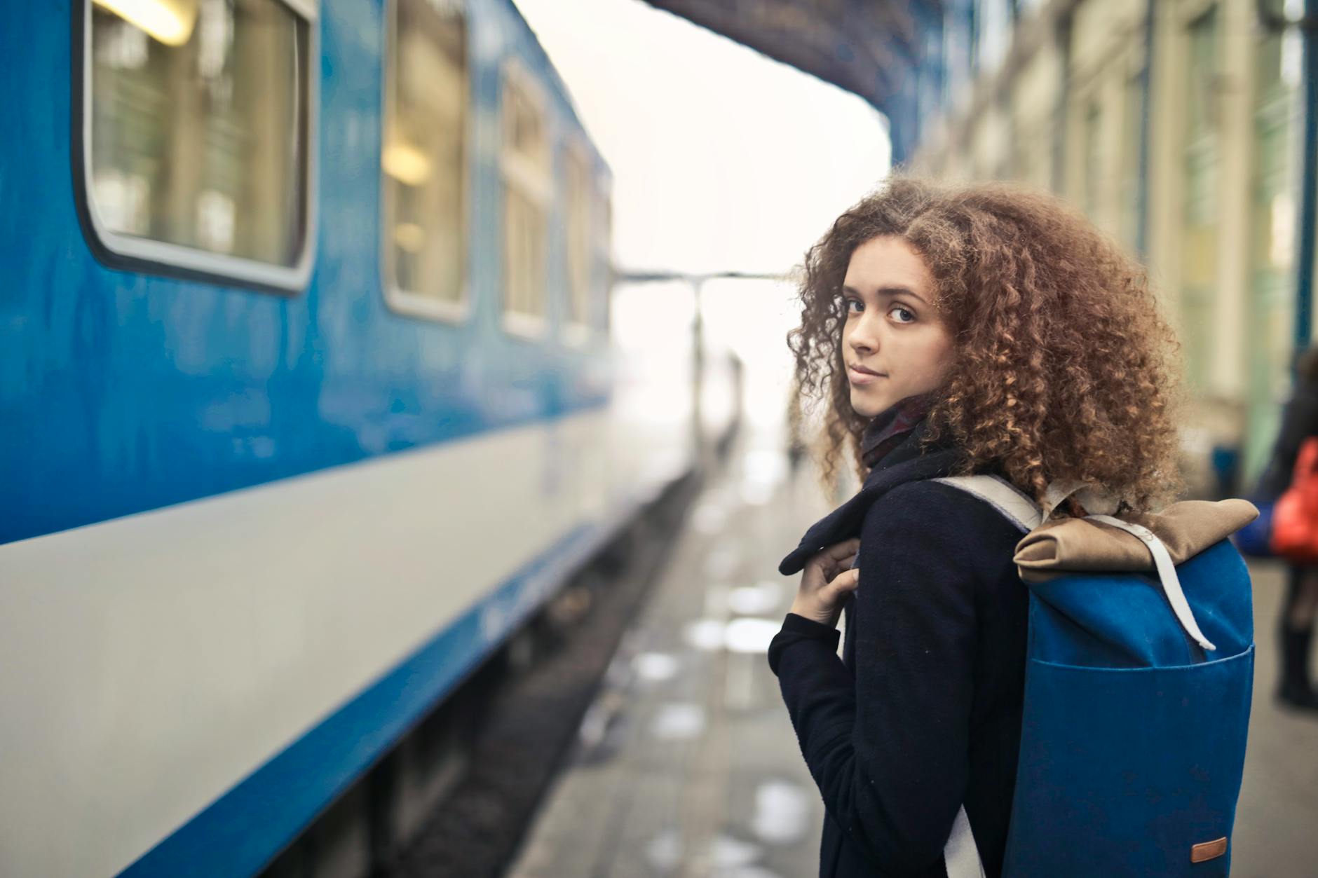 First trip — Indian woman at train station ready to travel
