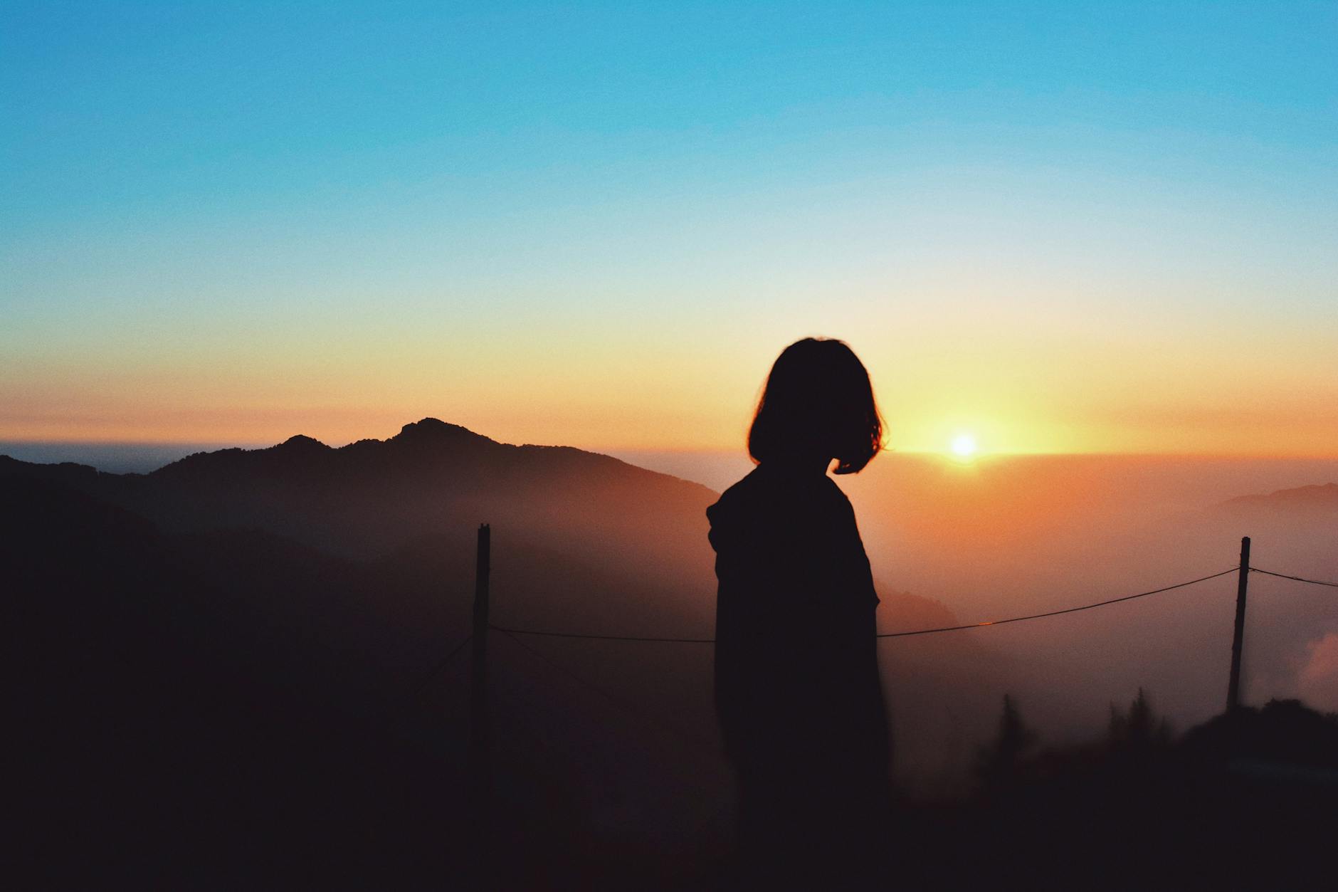 Travel transformation — Indian woman at sunrise