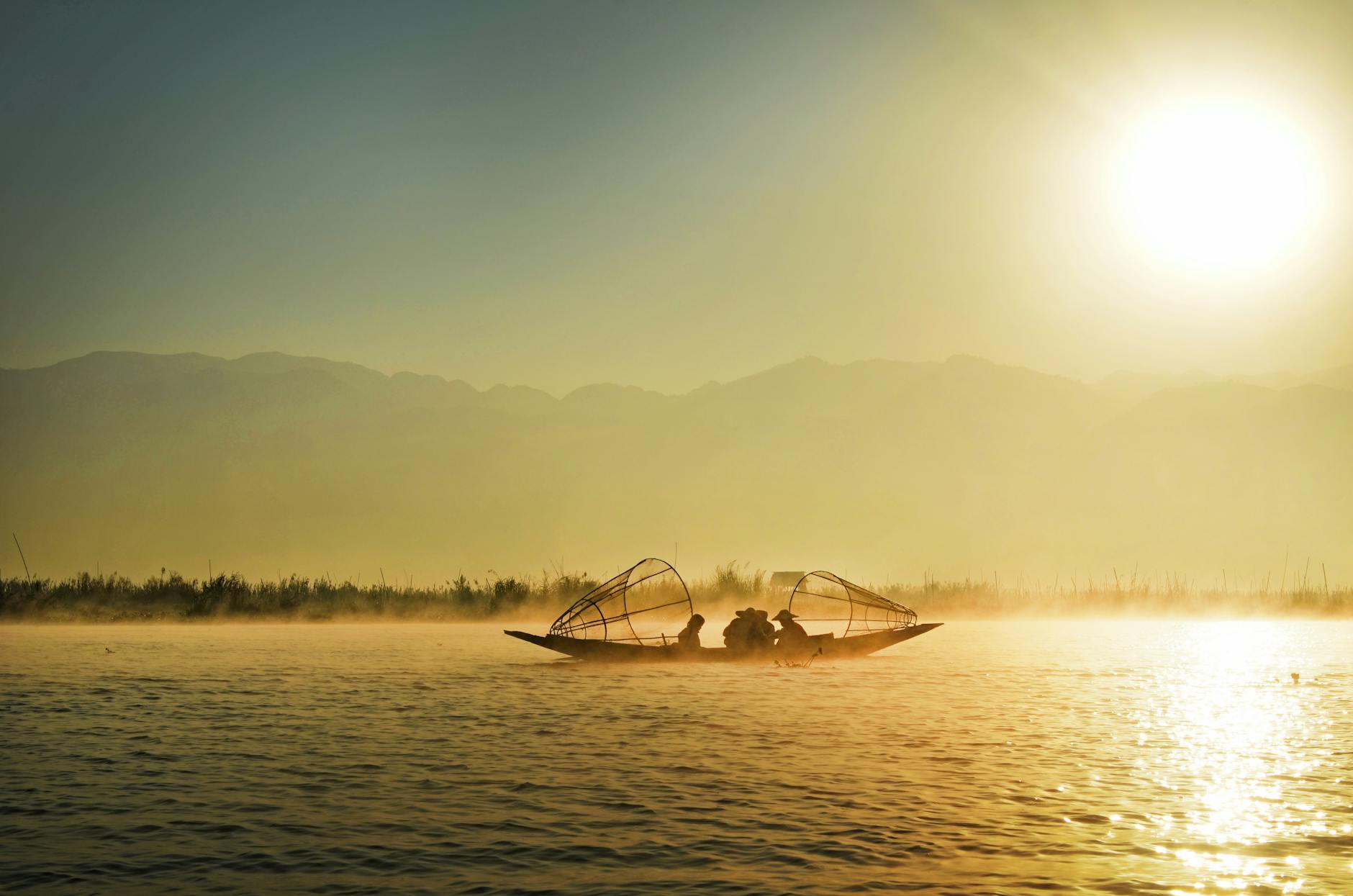 Loktak Lake Manipur floating phumdis fishermen dawn mist Sangai deer